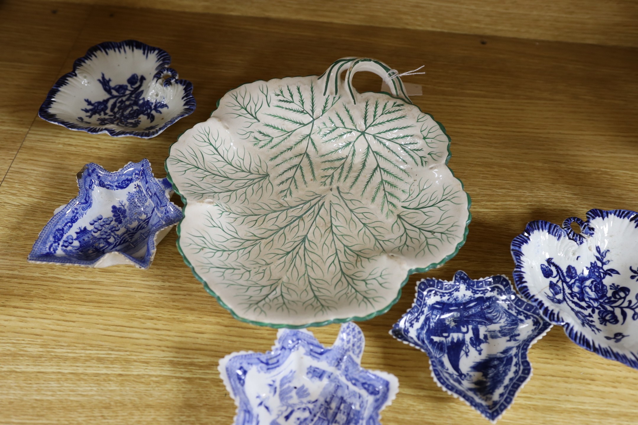 A group of late 18th century Liverpool porcelain leaf pickle dishes, and later pearlware leaf dishes